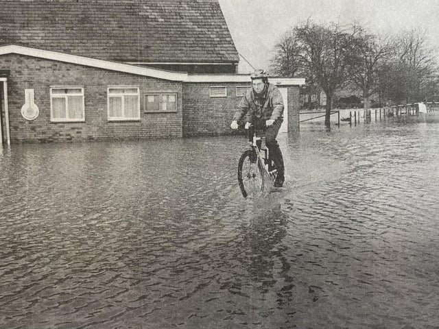 This resident didn't let the floods get in the way of his bike ride.