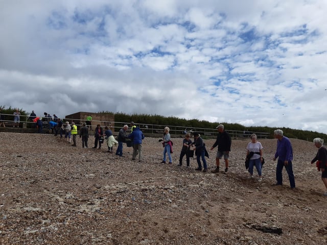 A bucket chain of volunteers from Ferring History Group and Ferring Conservation Group, including Worthing West MP Sir Peter Bottomley, form a bucket chain to bail out nine inches of water from the Ferring pillbox