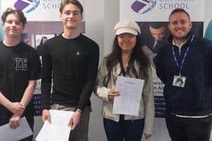 Pictured are The Gatwick School Headteacher, Mr David Marillat, and students from last years Year 11 on results day.