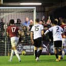 Sam Hasler's free kick is deflected in for Hastings' winner against Lewes | Picture: Scott White