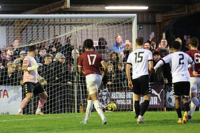 Sam Hasler's free kick is deflected in for Hastings' winner against Lewes | Picture: Scott White