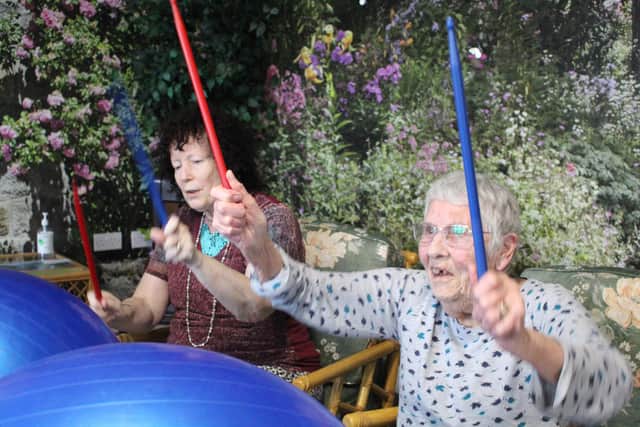 Joy takes full advantage of the many weekly activities, like drumming