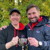 Heath U12 coaching team show off the spoils of victory in the Land Rover Cup. Picture: HHRFC