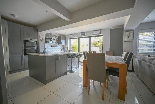 The well-fitted kitchen and dining area comes with plenty of space to entertain.