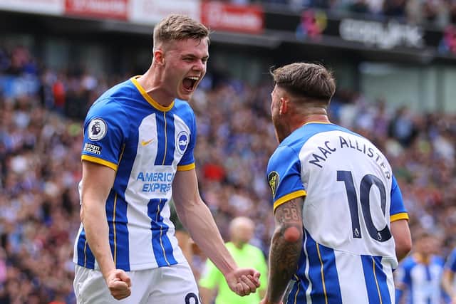 Evan Ferguson celebrates with teammate Alexis Mac Allister after scoring the team's first goal  during the Premier League match between Brighton & Hove Albion and Southampton FC at American Express Community Stadium on May 21, 2023 in Brighton, England. (Photo by Richard Heathcote/Getty Images)