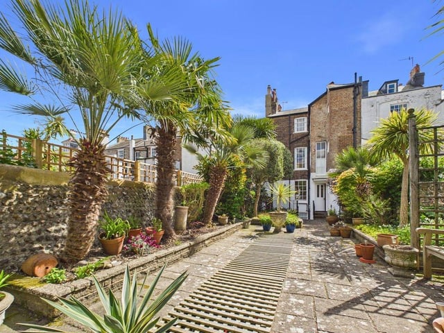 At the rear, the rare addition of a double garage offers secure parking and excellent storage
