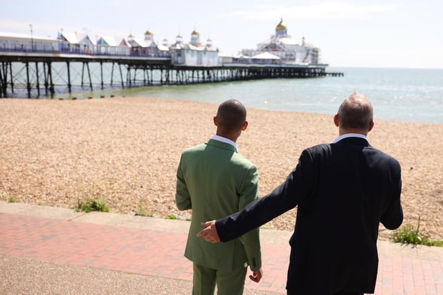 EASTBOURNE, ENGLAND - MAY 24: Liberal Democrat leader Ed Davey with Liberal Democrat candidate Josh Babarinde look out at the pier during a visit to the marginal seat of Eastbourne on May 24, 2024 in Eastbourne, England. The Liberal Democrats are targeting Conservative marginal seats along the South Coast in the upcoming general election on July 4th.  (Photo by Dan Kitwood/Getty Images)
