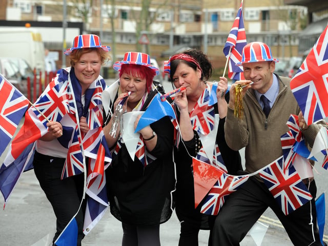 U-Need-Us staff (l-r) Allison Brookes (correct), Karen Knipe, Tracey Knipe and Steve Searle get the street party started outside the store in February 2011. Picture: Allan Hutchings (110573-278)