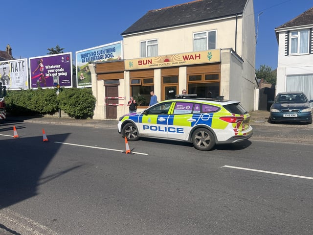 Two people taken to hospital after car collides with building in West Sussex
