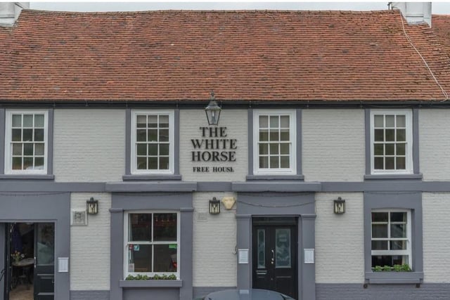 White Horse, Ditchling. A 12th-century inn that lies below the parish church in the picturesque, historic village of Ditchling. Its cellar leads to a network of tunnels under the village, thought to have been used for smuggling in times past. Popular with walkers on the South Downs Way.
