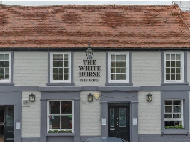 White Horse, Ditchling. A 12th-century inn that lies below the parish church in the picturesque, historic village of Ditchling. Its cellar leads to a network of tunnels under the village, thought to have been used for smuggling in times past. Popular with walkers on the South Downs Way.