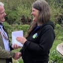 Collyer's Dr Ian Carr presents £200 raised by students to RSPB Pulborough