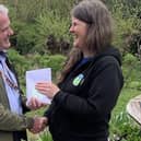 Collyer's Dr Ian Carr presents £200 raised by students to RSPB Pulborough