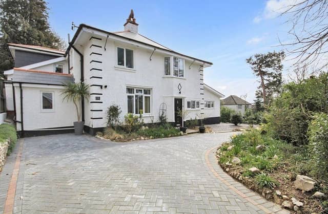 This four-bedroom detached house comes with full planning permission for a detached chalet bungalow at the rear