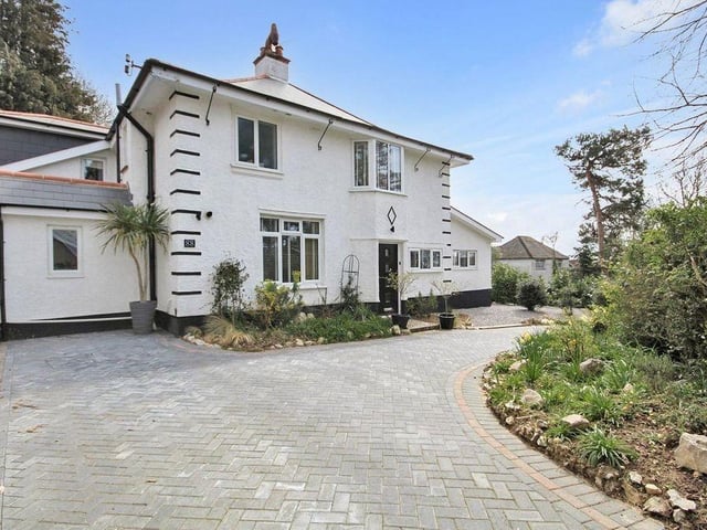 This four-bedroom detached house comes with full planning permission for a detached chalet bungalow at the rear