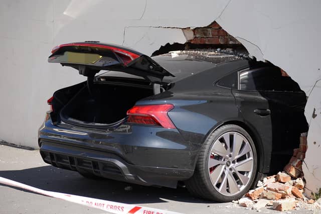 Three people injured after car crashes into wall of house in Eastbourne - in pictures