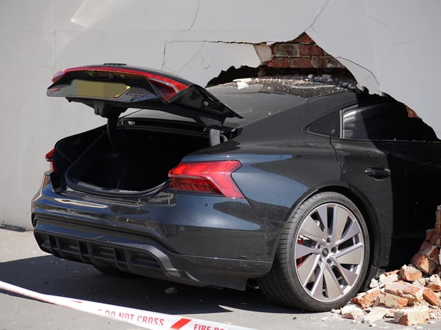 Three people injured after car crashes into wall of house in Eastbourne - in pictures
