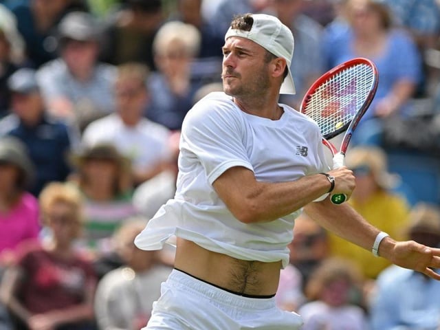 US player Tommy Paul returns to Argentina's Francisco Cerundolo during their men's singles final tennis match at the Rothesay Eastbourne International tennis tournament in Eastbourne, southern England, on July 1, 2023. (Photo by Glyn KIRK / AFP) (Photo by GLYN KIRK/AFP via Getty Images):Action from Saturday's finals at the Rothesay tennis international at Devonshire Park, Eastbourne
