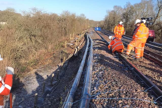 Engineers working at the site of the landslip between Hurst Green and East Grinstead. Photo: Network Rail Kent & Sussex