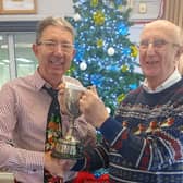 Les Boniface, right, is presented with the Don Moore Trophy by Graham Farley
