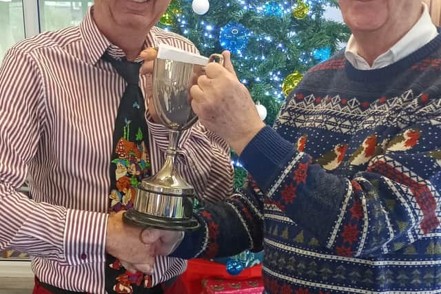 Les Boniface, right, is presented with the Don Moore Trophy by Graham Farley