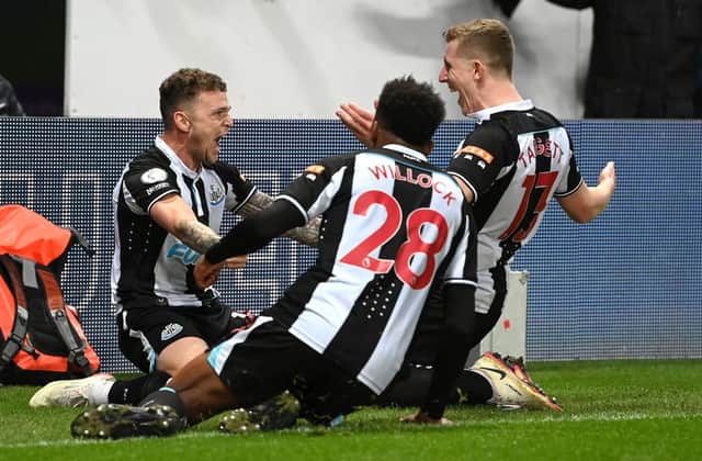 Kieran Trippier celebrates with team mates after scoring the third goal during the Premier League match between Newcastle United and Everton. (Photo by Stu Forster/Getty Images)