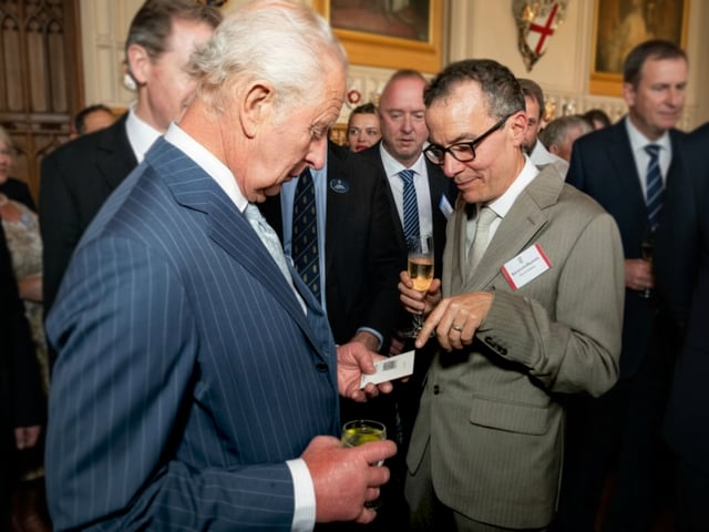 Flare Audio co-chief executive Davies Roberts with King Charles at a royal reception last June