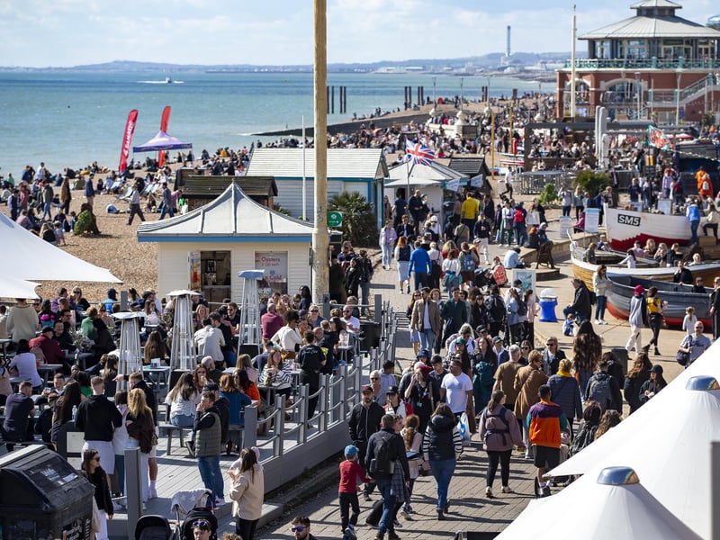 People enjoy the spring sunshine this Good Friday on Brighton seafront in East Sussex.