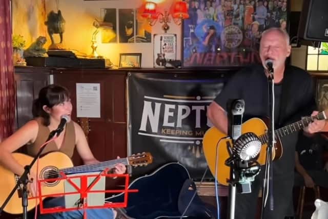 David Gilmore plays with daughter Romany at open mic night at Sussex pub