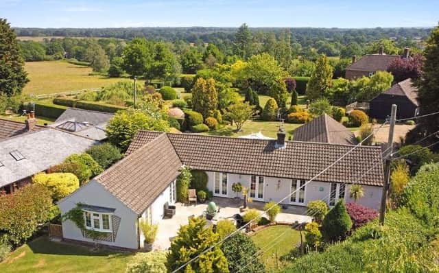 This four-bedroom bungalow in Sedgwick Lane, Horsham, has a separate one bedroom annexe and is on sale with a guide price of £1,200,000