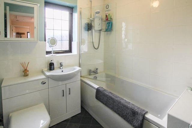 The family bathroom is on the first floor, and comprises bath with shower above, wash hand basin with vanity unit and low-flush WC.