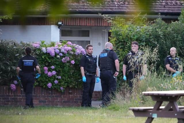 Police officers are the scene of the stabbing in St Andrews Close, Ferring, in July