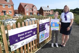Darcey Eldred, aged 9, with Taylor Wimpey Sales Executive Vicky Toghill