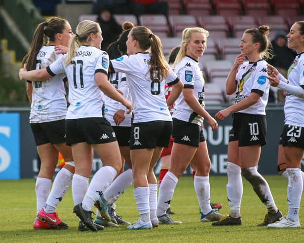 Lewes celebrate one of the six goals they put past Cardiff in the last round to set up this weekend's tie with Manchester United | Picture: James Boyes
