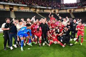 The Crawley Town players, manager Scott Lindsey and staff including Tom Allman (third from left) celebrate victory in front of their supporters during the EFL Sky Bet League 2 play-off second leg match between Milton Keynes Dons and Crawley Town at stadium:mk, Milton Keynes, England on 11 May 2024