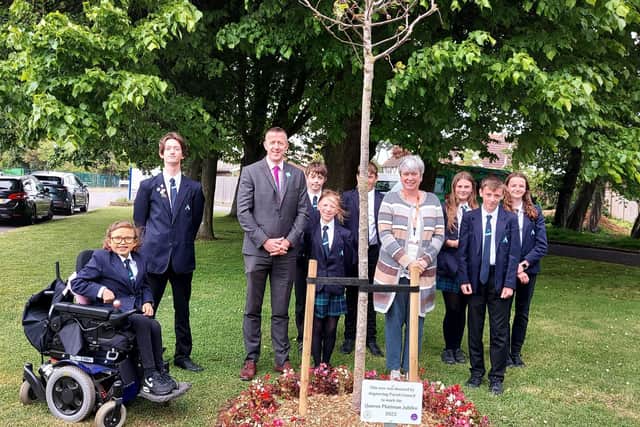 Headteacher Simon Liley and Nikki Hamilton-Street, parish council chair and acting chair of governors, with Zoe, Adam and Grace from year seven, Bradley and Oscar from year eight and Emily, Jessica and Bradley from year nine