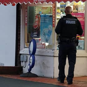 Police at the Post Office in High Street, Westham,