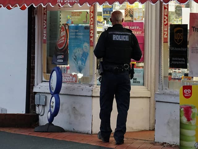Police at the Post Office in High Street, Westham,
