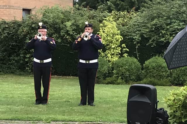 Buglers from Horley British Legion play the Last Post for 102 year old Steve Stenning.