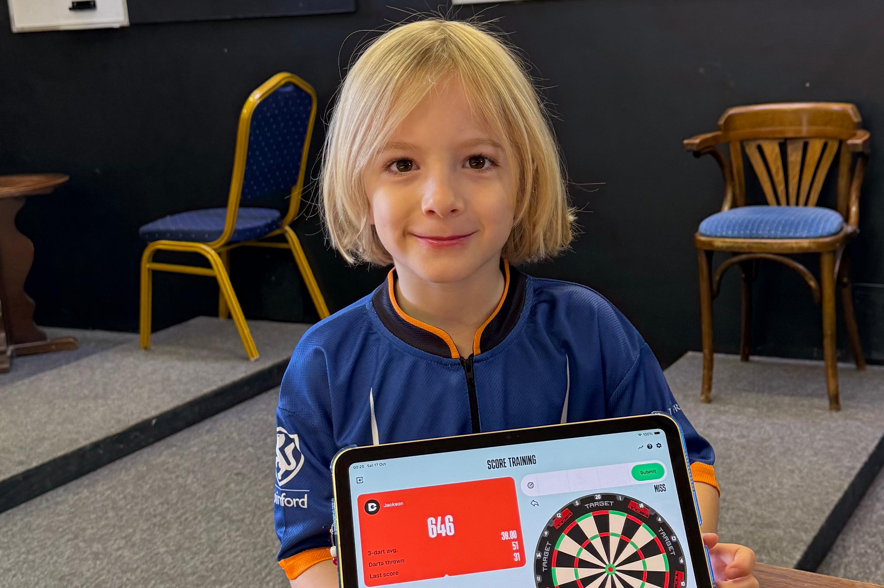 Brothers raise over £1000 for Macmillan in 12-hour dart marathon.