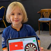 Brothers raise over £1000 for Macmillan in 12-hour dart marathon.