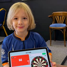 Brothers raise over £1000 for Macmillan in 12-hour dart marathon.