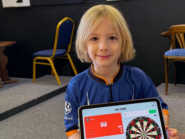 Brothers raise over £1000 for Macmillan in 12-hour dart marathon.
