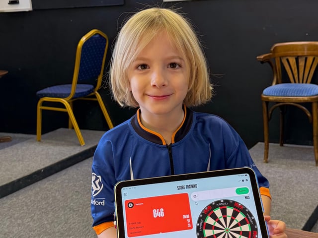 Brothers raise over £1000 for Macmillan in 12-hour dart marathon.