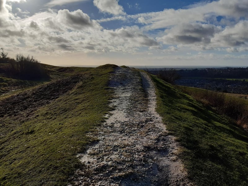 You can climb up to walk around the ramparts if you wish (centre) or stay on the grassy area to walk round the bottom of them. It is possible to do a full circuit of Cissbury Ring in either direction if you want to but for this walk, we are turning right to head anti-clockwise.