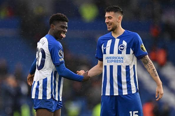 Carlos Baleba and Jakub Moder of Brighton celebrate at the end of the Premier League match against Nottingham Forest