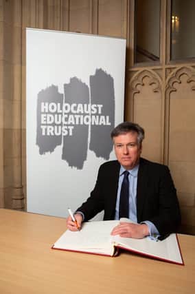 Henry Smith MP signs the Holocaust Educational Trust Book of Commitment