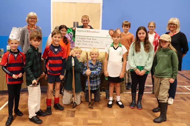 Highfield and Brookham pupils presented a cheque for £7,068 to Liphook Food Bank
