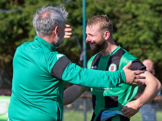 Burgess Hill Town players, fans and staff celebrate surviving in the Isthmian south east division at the end of their 0-0 draw with Beckenham