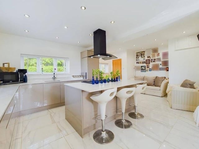 The luxury kitchen has an integrated fridge/freezer and dishwasher